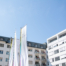 Das Krankenhaus BHS Linz ist von außen zu sehen, darüber strahlend blauer Himmel.